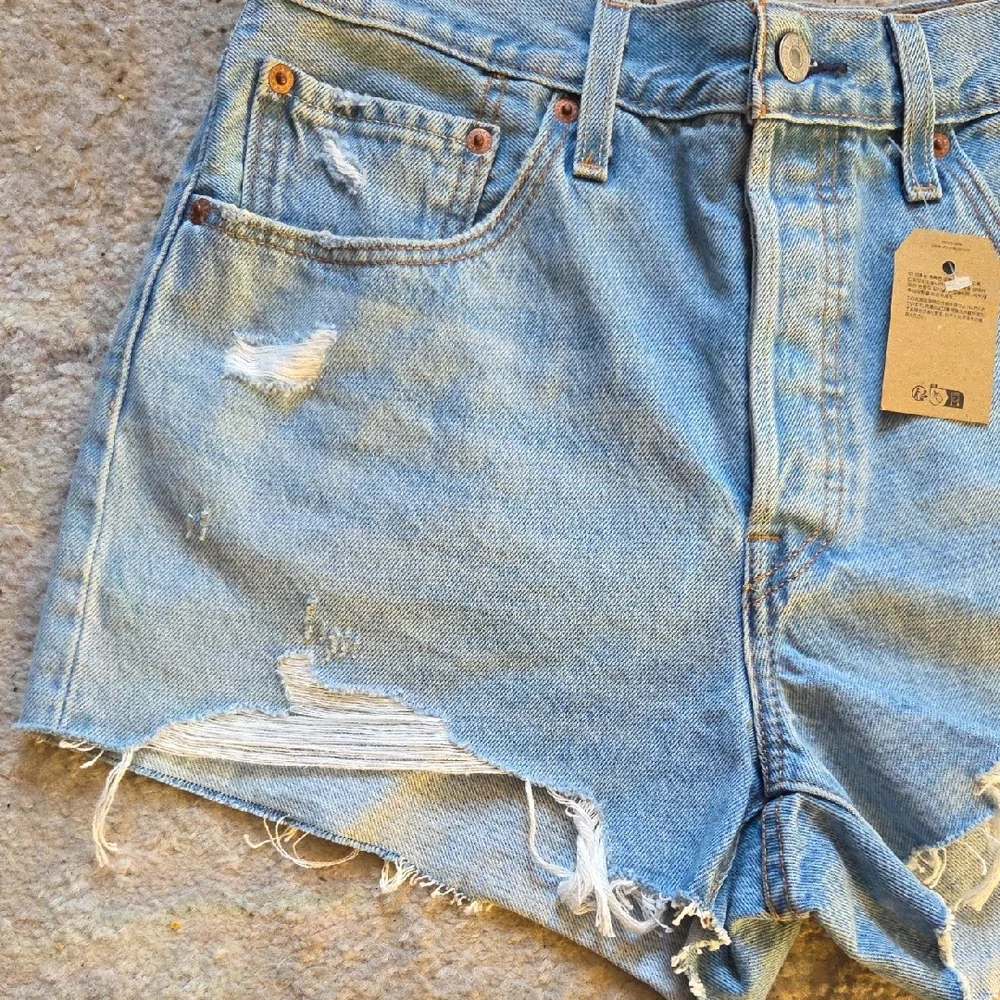 Levi's 501 Light Blue Distressed Jean Shorts‎
